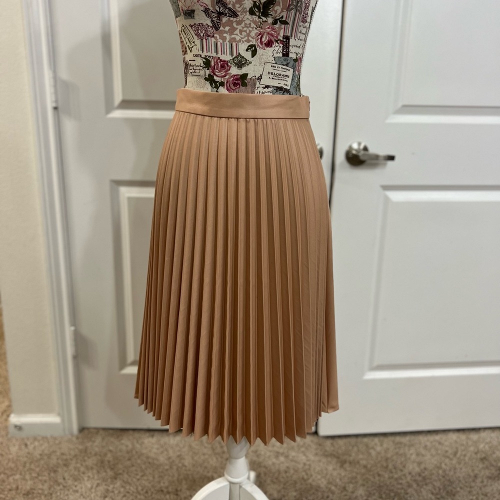 Pastel pink pleated midi skirt by Zara